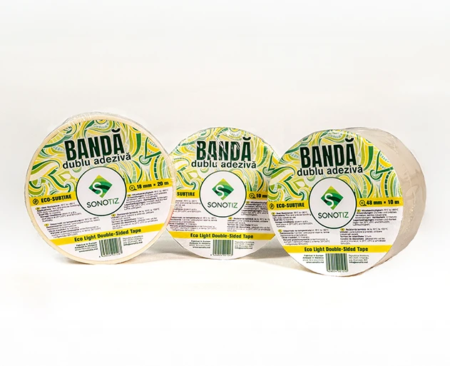 Heat-resistant double-sided tape roll with protective liner used to secure insulation and soundproofing materials.